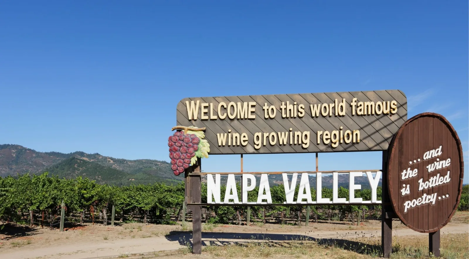 Roadside sign welcoming visitors to Napa Valley's wine growing region